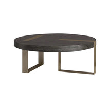 Round coffee table crafted from white oak wood with a brass foundation